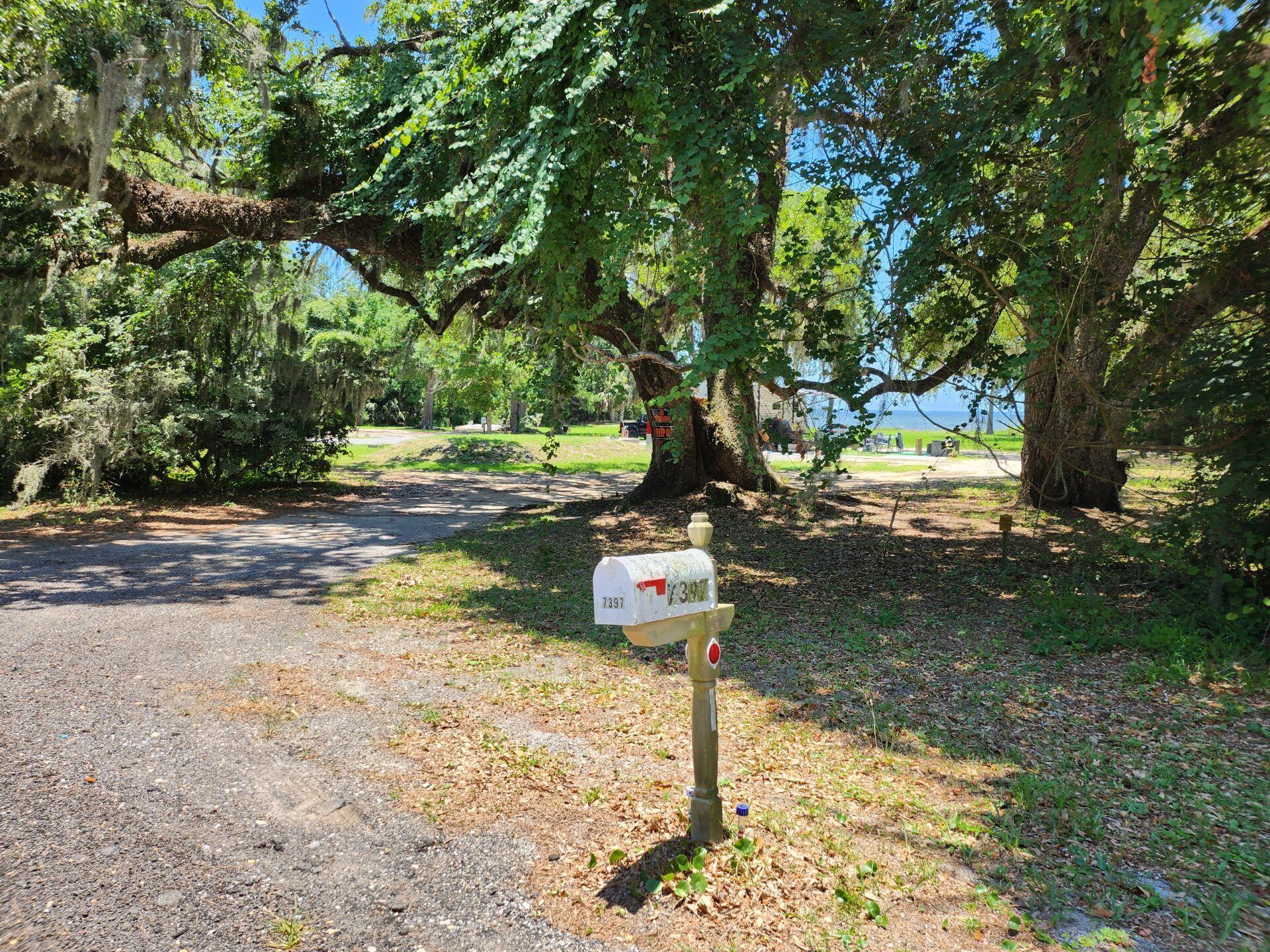 7397 Highway 20 Freeport, FL 32439 - Photo 18 of 23 a front view of a house with a yard