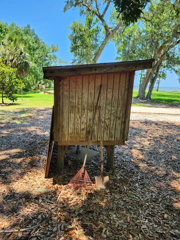 a view of a backyard with a small cabin