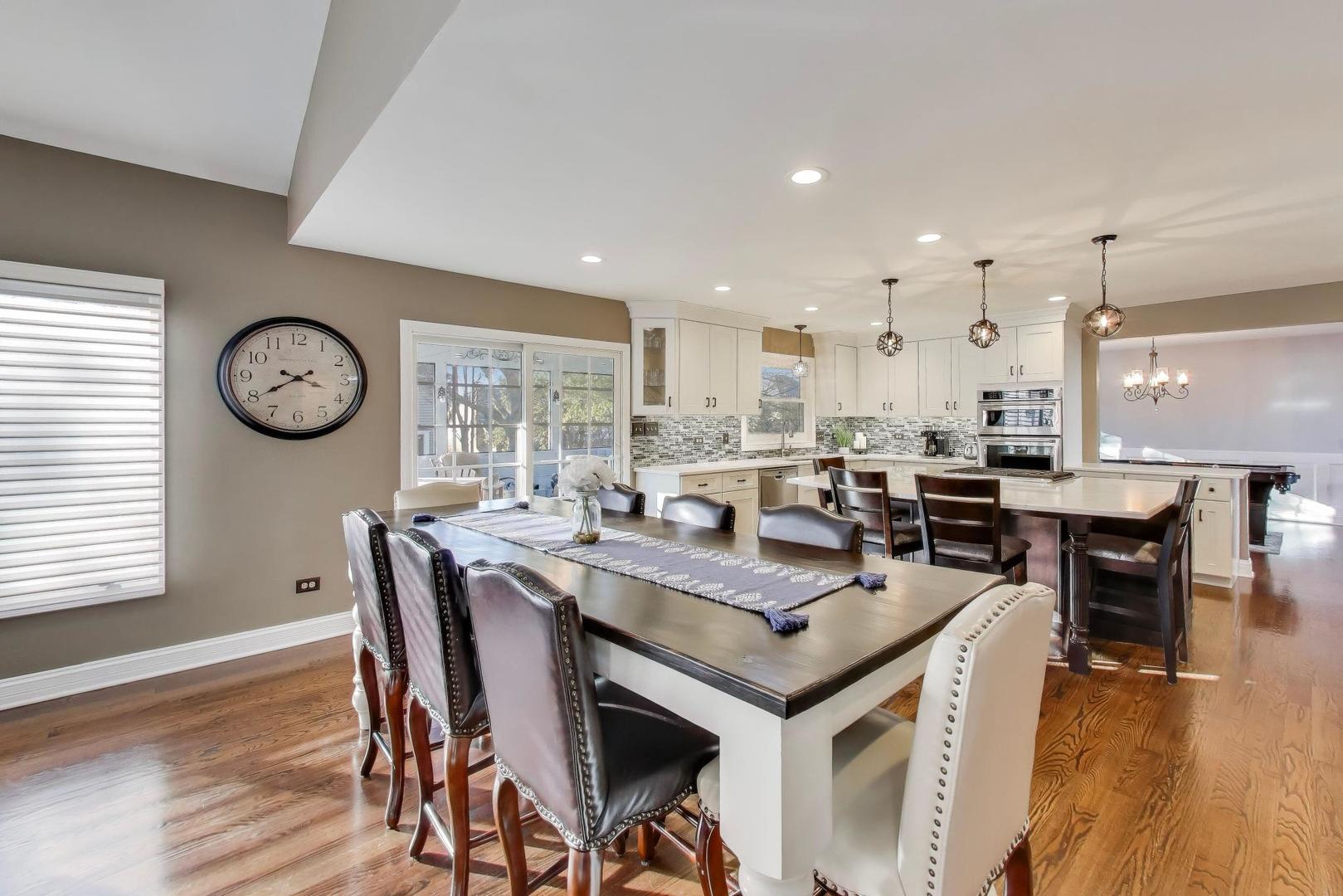 2103 Primrose Lane Naperville, IL 60565 - Photo 11 of 40 a view of a dining room with furniture and wooden floor