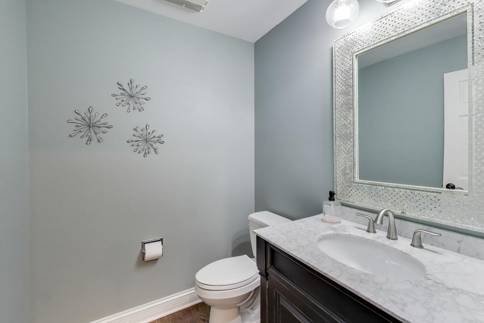 2103 Primrose Lane Naperville, IL 60565 - Photo 14 of 40 a bathroom with a granite countertop sink a toilet and a mirror
