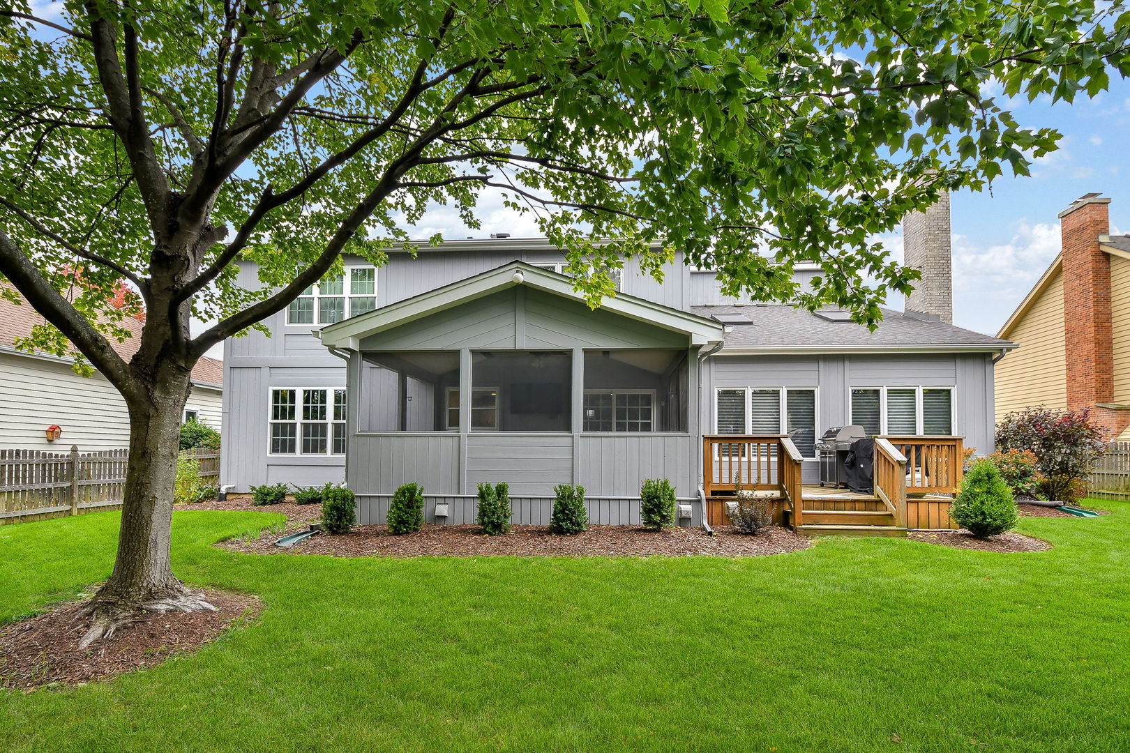 2103 Primrose Lane Naperville, IL 60565 - Photo 30 of 40 a view of a house with a yard deck and a large tree