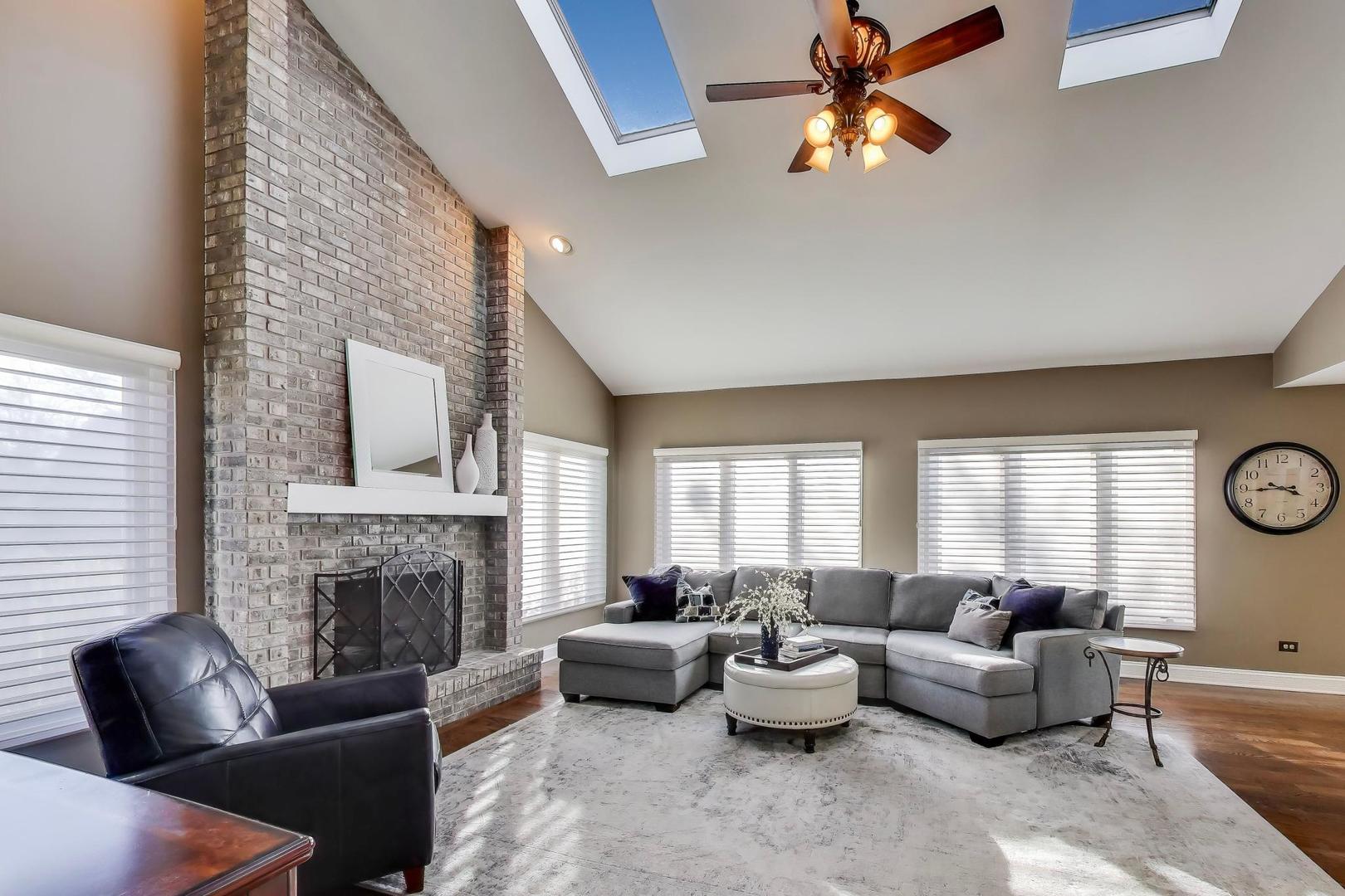 2103 Primrose Lane Naperville, IL 60565 - Photo 10 of 40 a living room with furniture fireplace and window