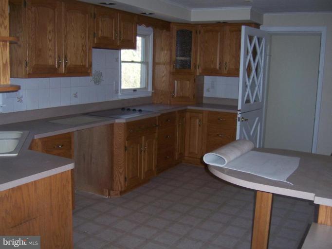 2704 Overview Road Hampstead, MD 21074 - Photo 5 of 12 a kitchen with a refrigerator and window