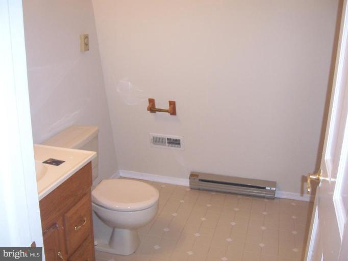2704 Overview Road Hampstead, MD 21074 - Photo 10 of 12 a bathroom with a toilet a sink and bathtub