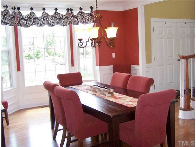 524 Elan Hall Road Cary, NC 27519 - Photo 4 of 25 Oversized Dining Room with Custom Draperies and Hardwood Floors...wonderful place to gather with family and friends. Dining Room