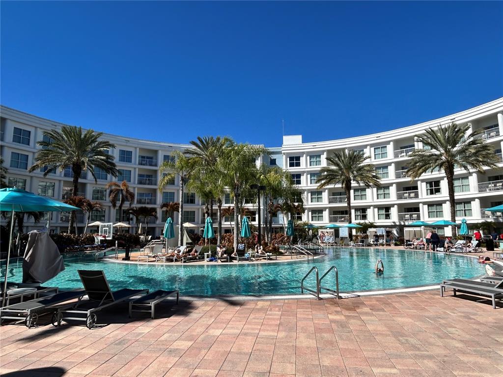 225 Celebration Place, Unit 446 Kissimmee, FL 34747 - Photo 15 of 17 a view of building with yard