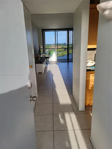 a view of entryway and kitchen