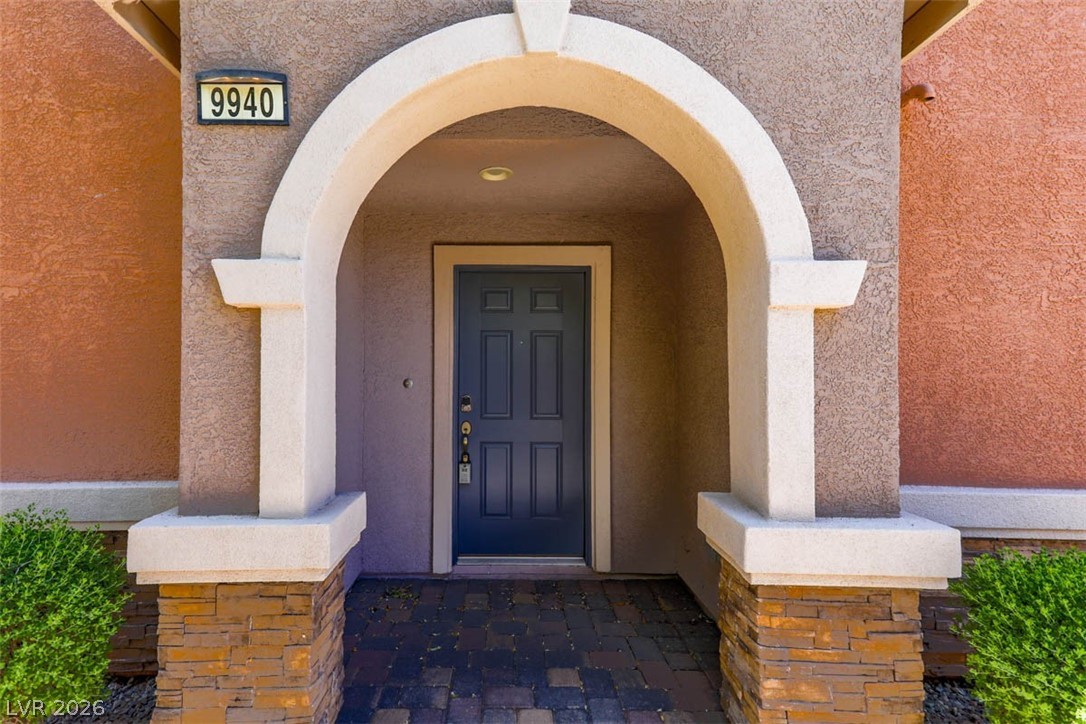 9940 Sable Point Street Las Vegas, NV 89178 - Photo 8 of 40 Doorway to property with stucco siding
