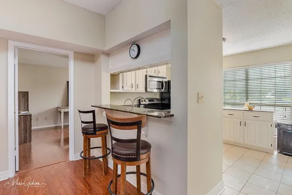 a kitchen with a sink cabinets and window