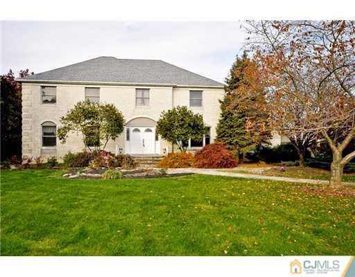 190 Friendship Road Cranbury, NJ 08512 - Photo 1 of 24 a front view of a house with a garden and yard