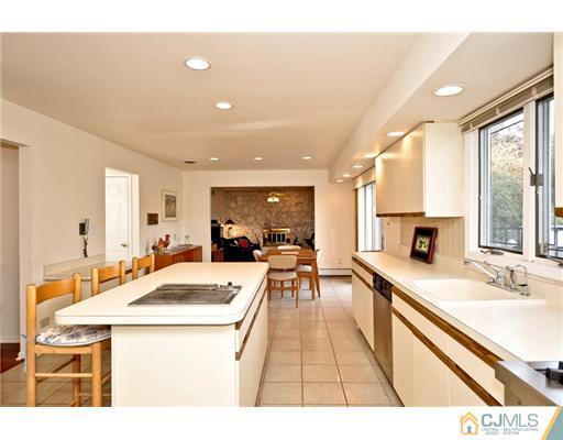 190 Friendship Road Cranbury, NJ 08512 - Photo 13 of 24 a room with stainless steel appliances kitchen island granite countertop a sink and cabinets