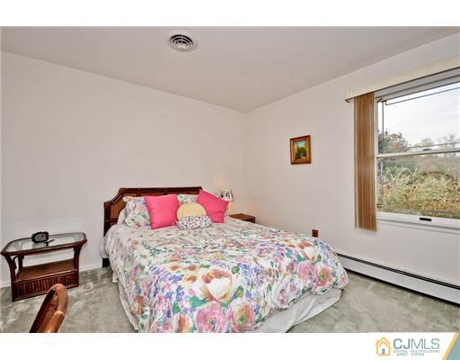 190 Friendship Road Cranbury, NJ 08512 - Photo 17 of 24 a bedroom with a bed and a window