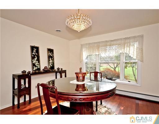 190 Friendship Road Cranbury, NJ 08512 - Photo 6 of 24 a dining room with furniture and a floor to ceiling window