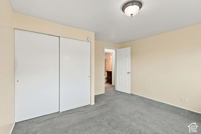 1127 Electra Lane Sandy, UT 84094 - Photo 10 of 27 Neutral-toned walls complement the gray carpeting