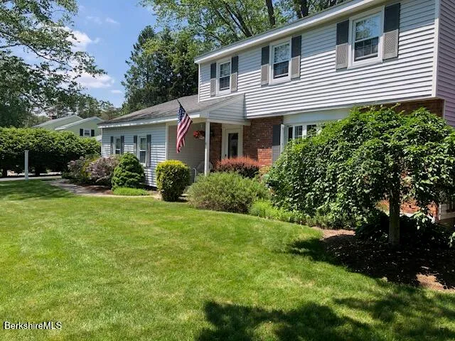 a view of swimming pool and trees in the background