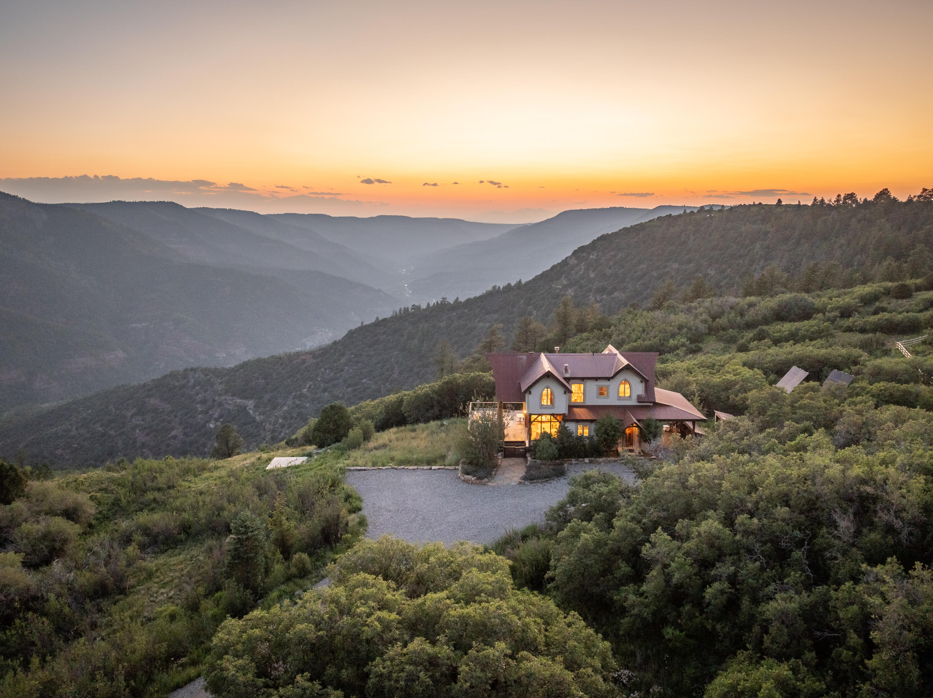 a aerial view of a house with mountain view