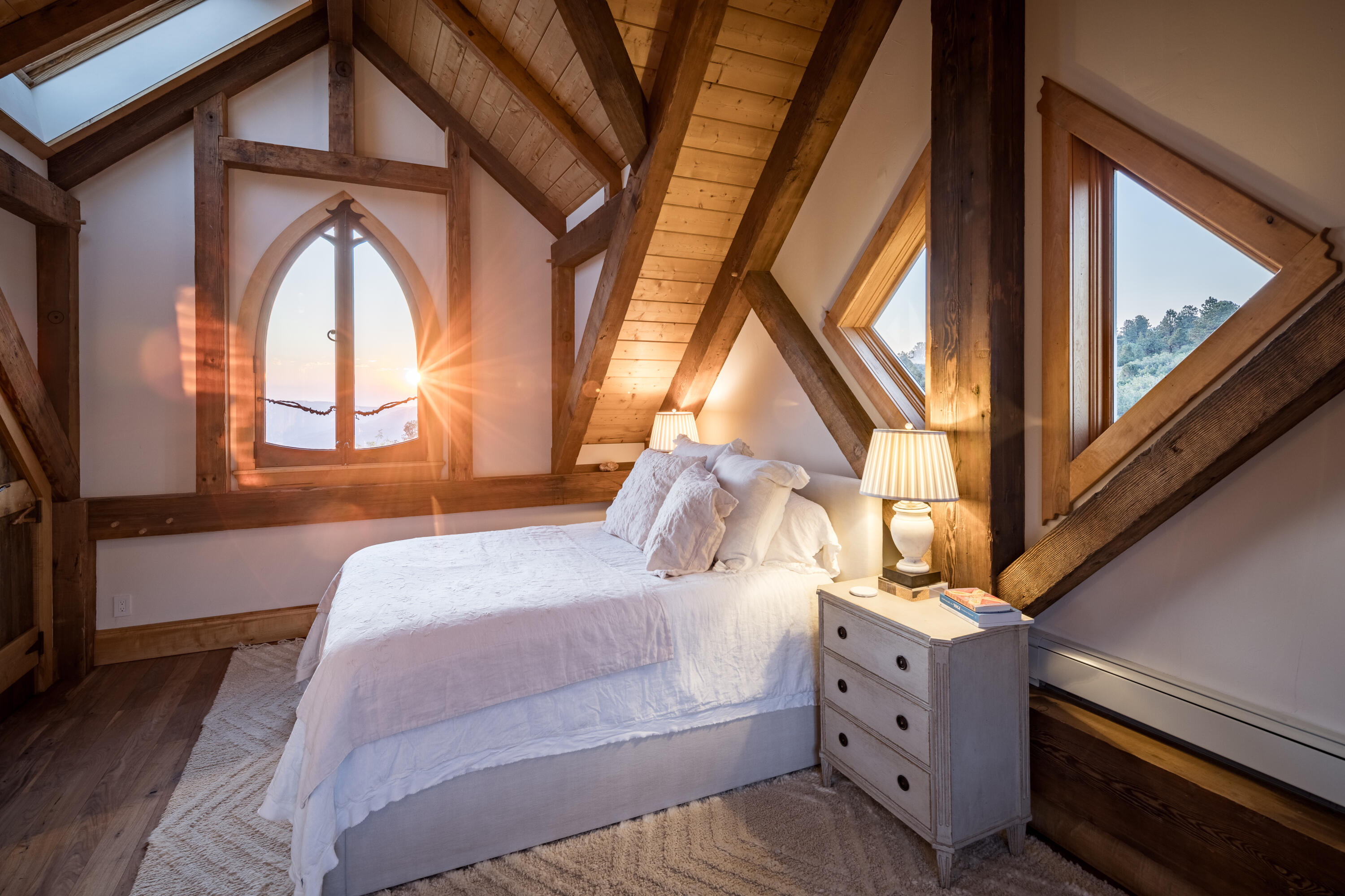 462 Dragon Lode Drive Placerville, CO 81430 - Photo 22 of 46 a bedroom with a large bed and a window