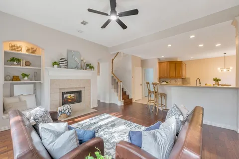 a living room with furniture and a floor to ceiling window