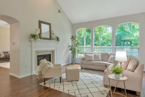 a living room with furniture and a fireplace