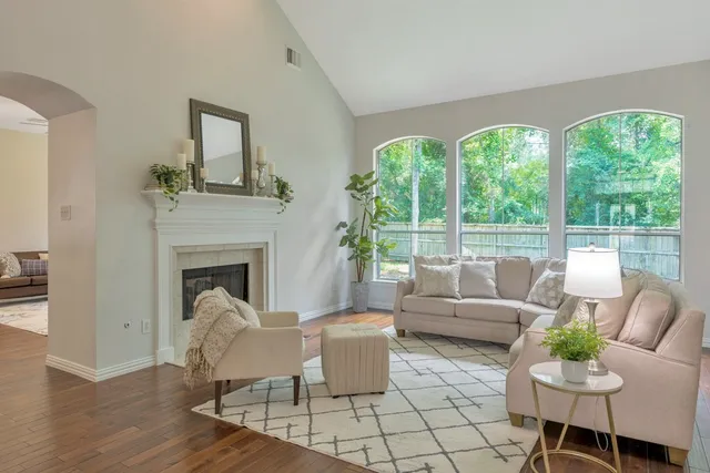 a living room with furniture and a fireplace