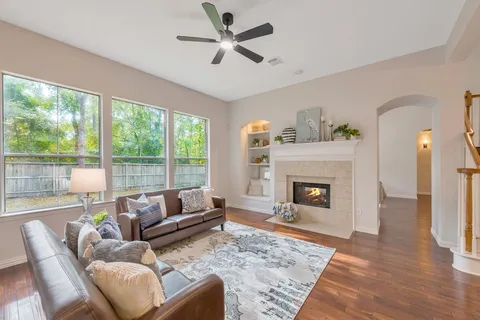 a living room with furniture and a fireplace