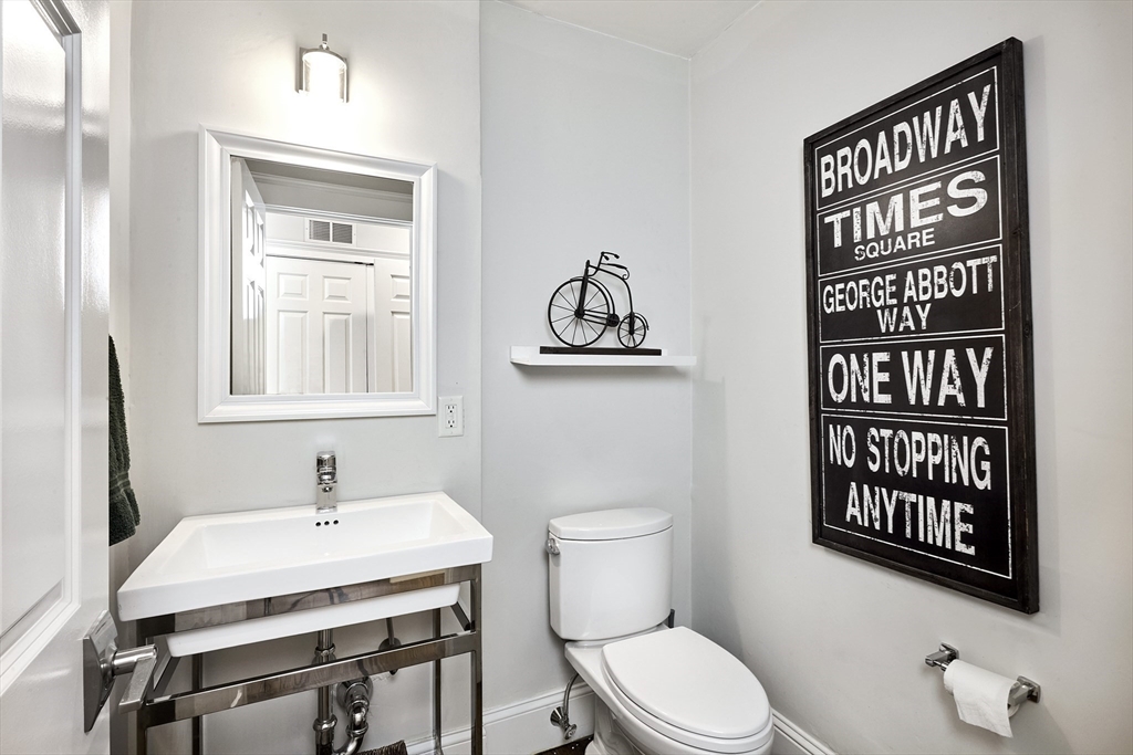 290 North Street, Unit 4 Boston, MA 02113 - Photo 7 of 28 a bathroom with a toilet a sink and a window
