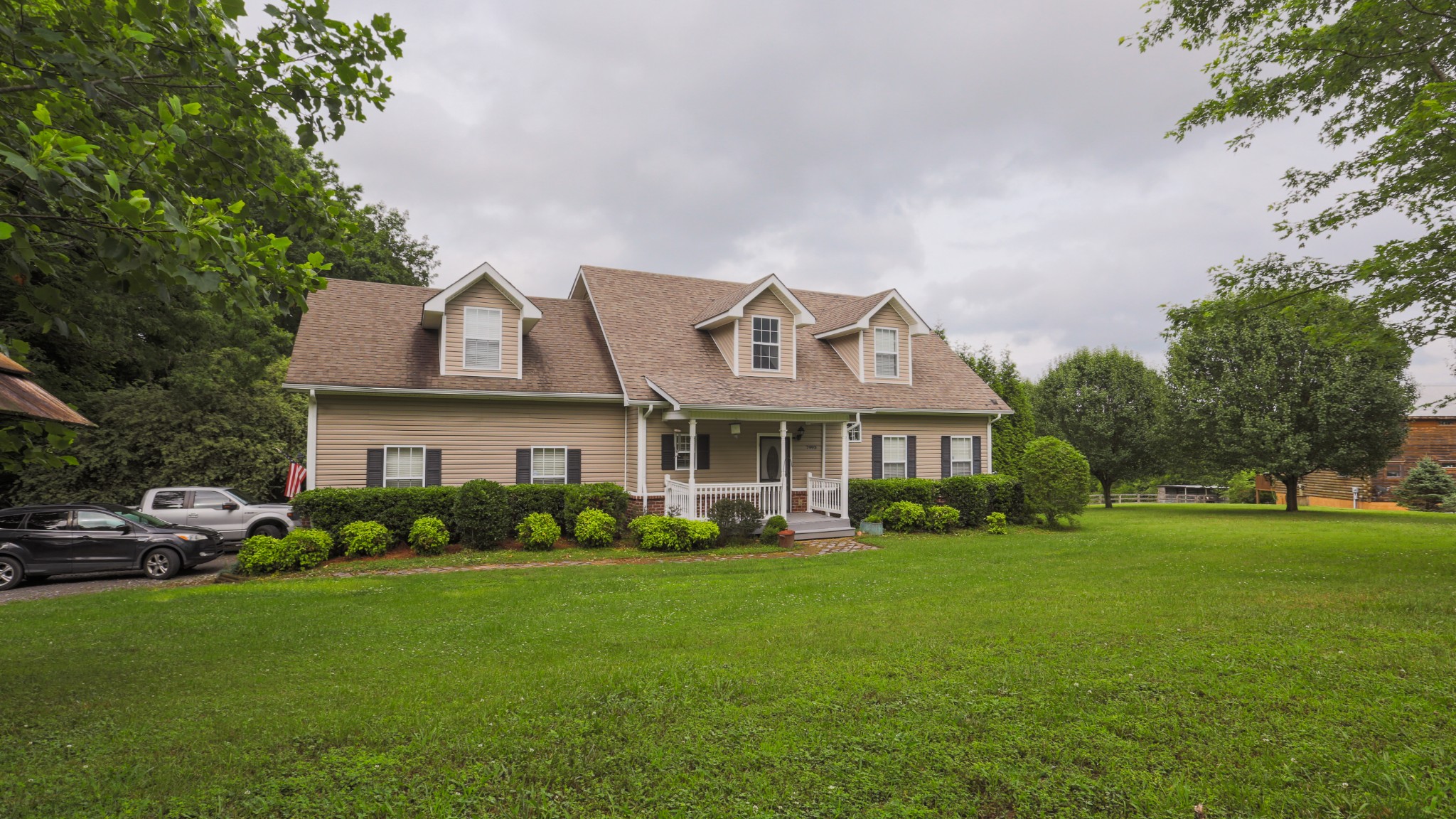 7993 Shoals Branch Road Primm Springs, TN 38476 - Photo 2 of 25 a front view of a house with garden