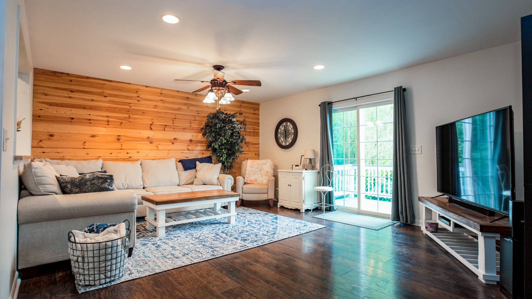 7993 Shoals Branch Road Primm Springs, TN 38476 - Photo 12 of 25 a living room with furniture and a flat screen tv