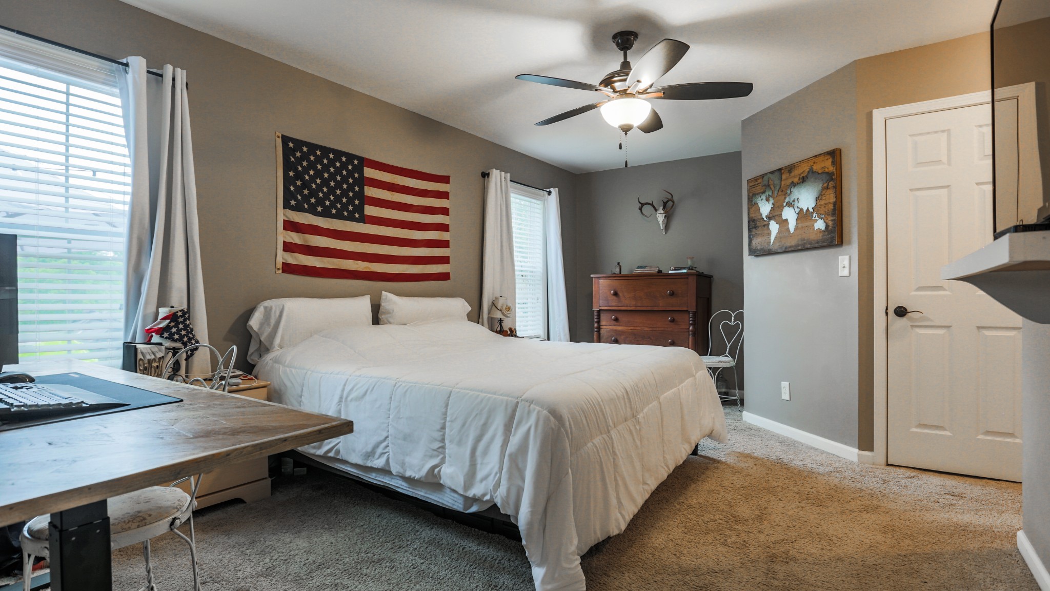 7993 Shoals Branch Road Primm Springs, TN 38476 - Photo 13 of 25 a bedroom with a large bed a chandelier and dresser