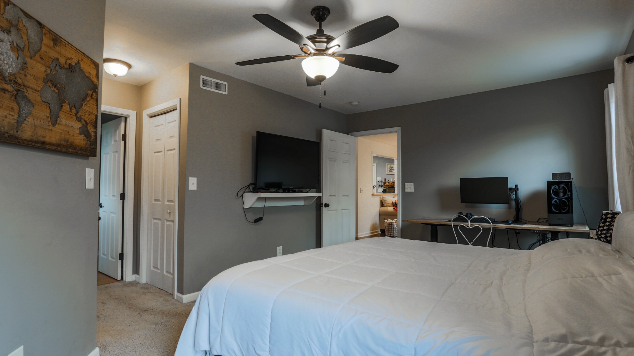 7993 Shoals Branch Road Primm Springs, TN 38476 - Photo 15 of 25 a bedroom with a bed and a flat tv screen on dresser