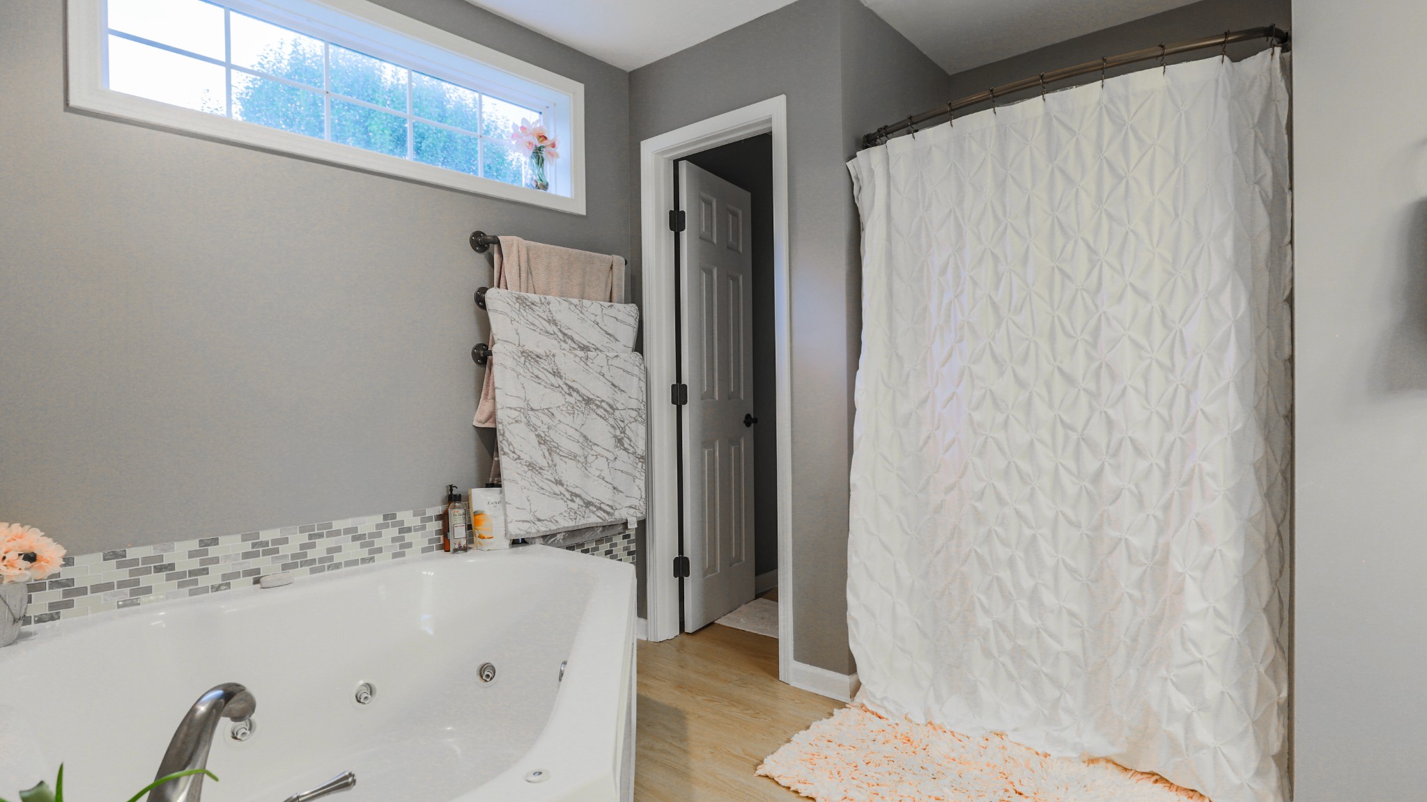 7993 Shoals Branch Road Primm Springs, TN 38476 - Photo 16 of 25 a bathroom with a bathtub and shower