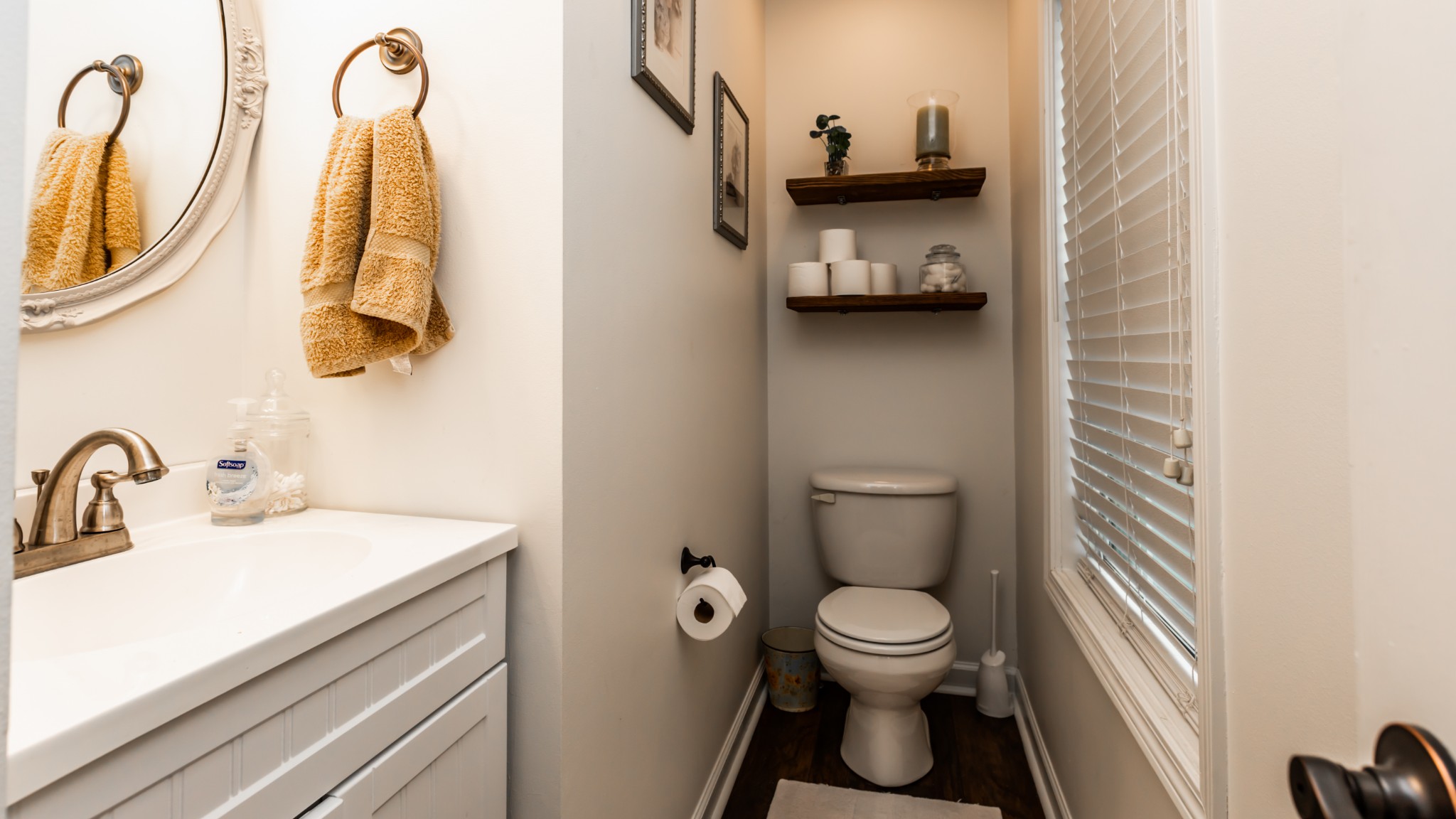 7993 Shoals Branch Road Primm Springs, TN 38476 - Photo 18 of 25 a bathroom with a toilet sink and mirror