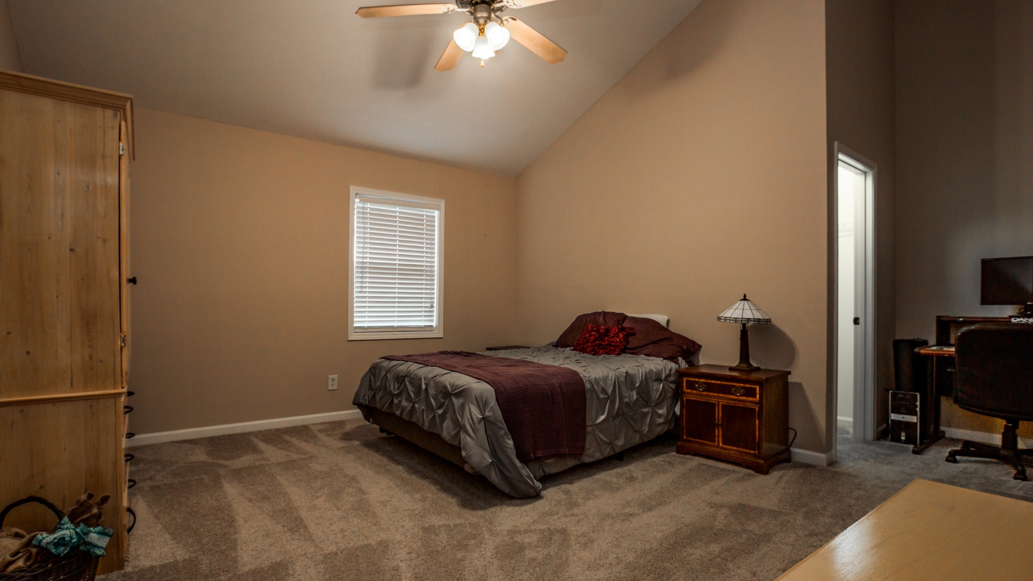 7993 Shoals Branch Road Primm Springs, TN 38476 - Photo 19 of 25 a bedroom with a bed and a chandelier