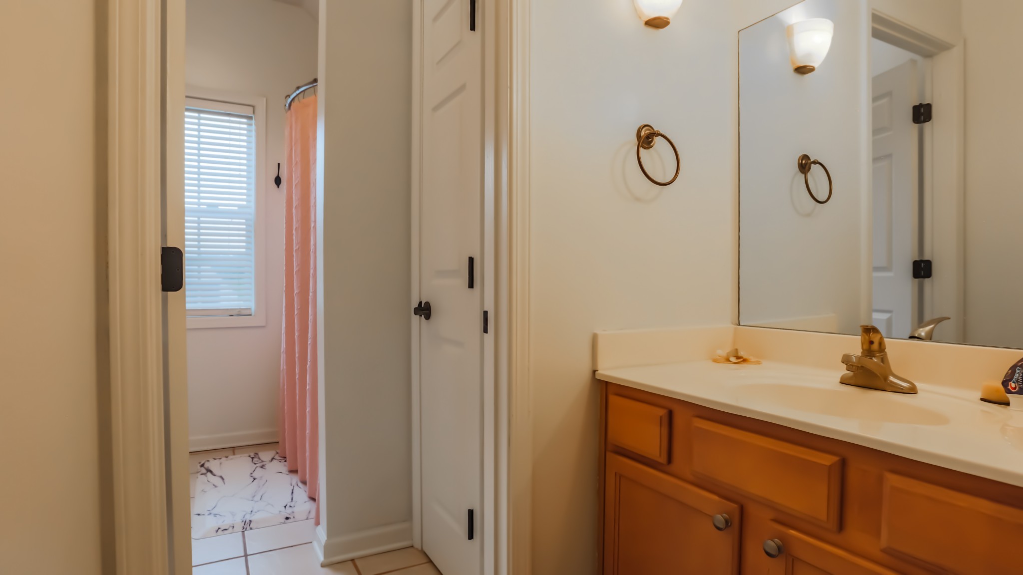 7993 Shoals Branch Road Primm Springs, TN 38476 - Photo 20 of 25 a bathroom with a granite countertop sink a mirror and shower