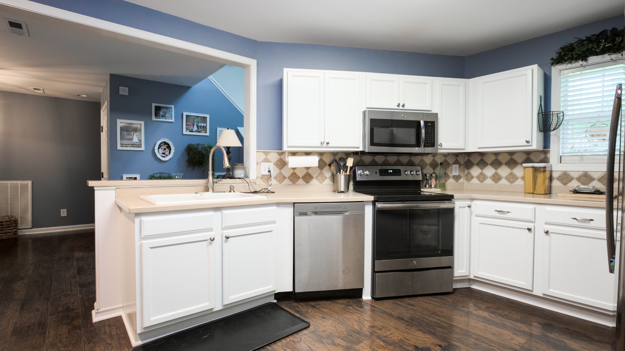 7993 Shoals Branch Road Primm Springs, TN 38476 - Photo 5 of 25 a kitchen with a sink stove and microwave