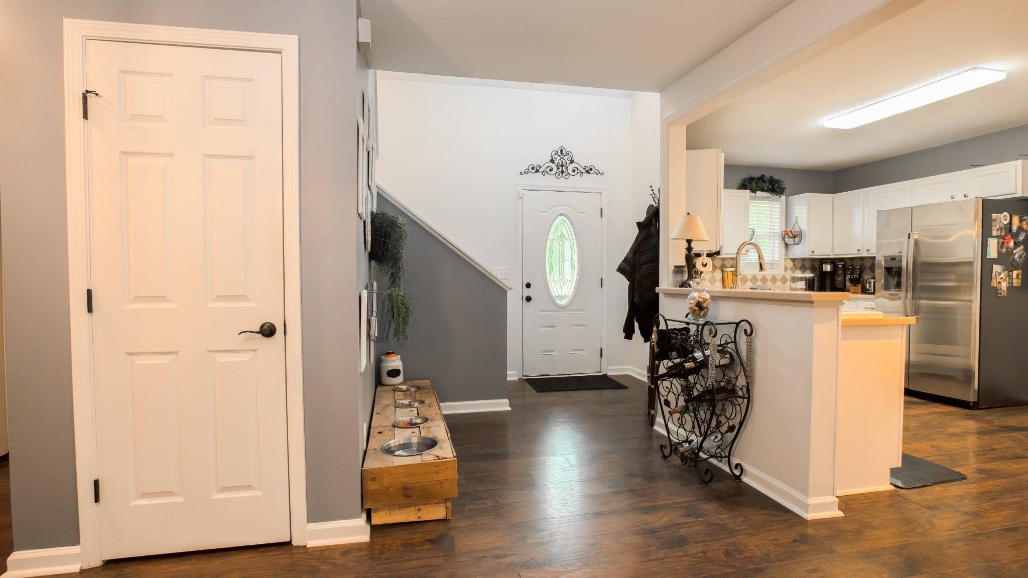 7993 Shoals Branch Road Primm Springs, TN 38476 - Photo 7 of 25 a view of a kitchen with refrigerator and wooden floor