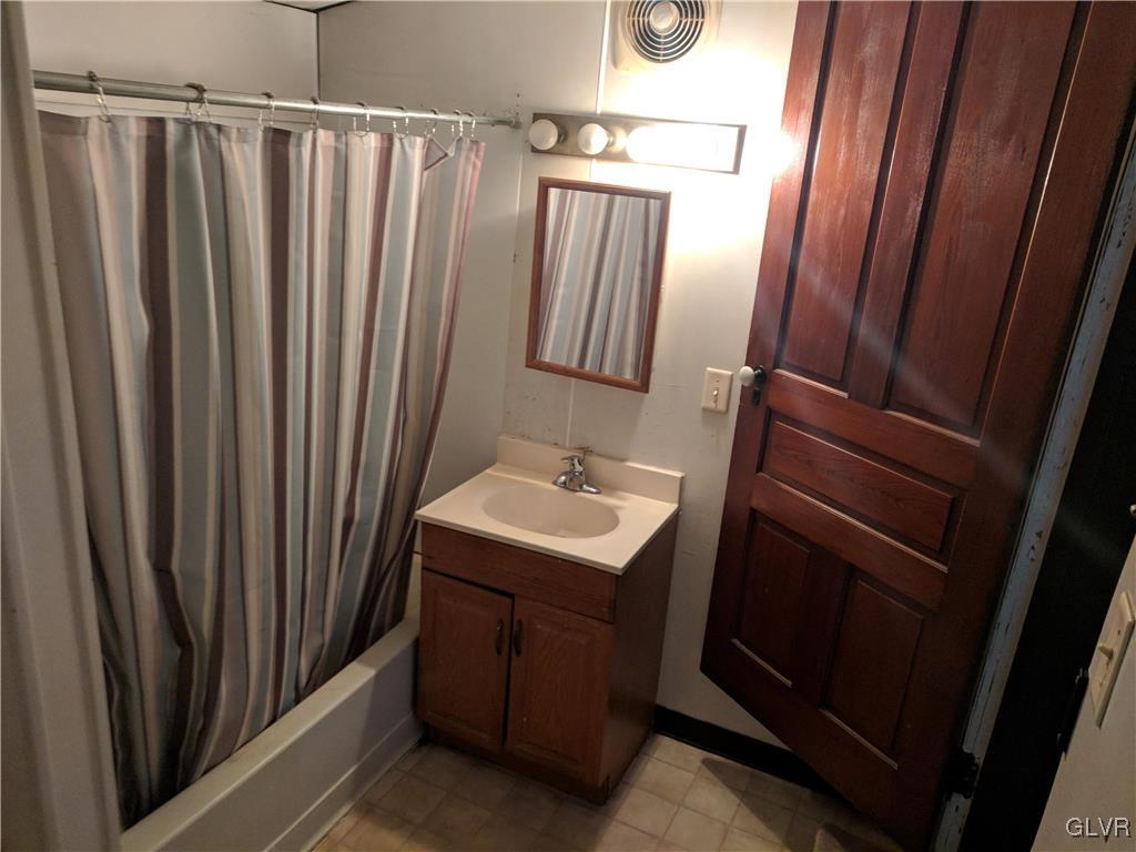 2 North 2nd Street Coplay, PA 18037 - Photo 4 of 14 a bathroom with sink a mirror a vanity and a shower