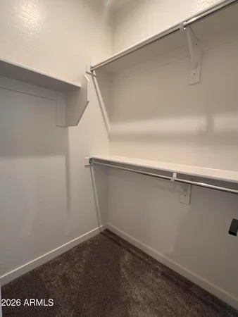 a bathroom with double vanity sinks and a mirror