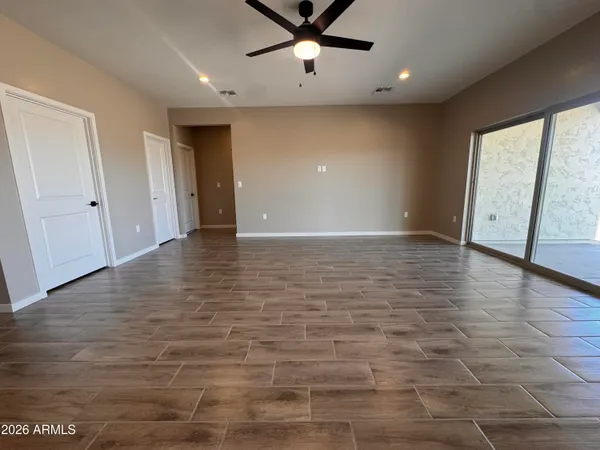 a view of kitchen with cabinets and wooden floor