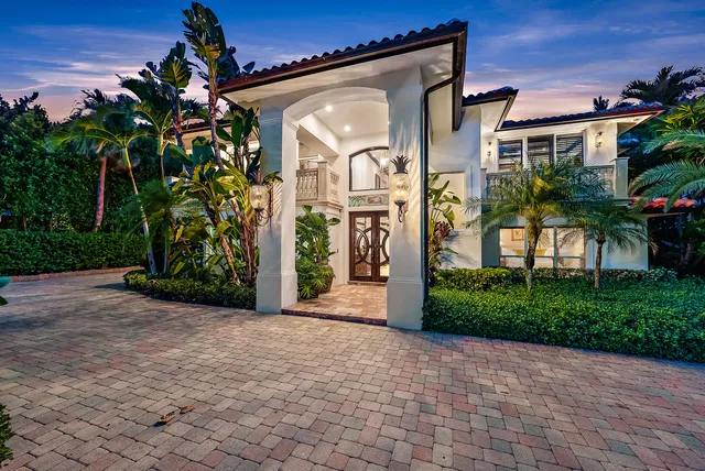a front view of house with yard and outdoor seating