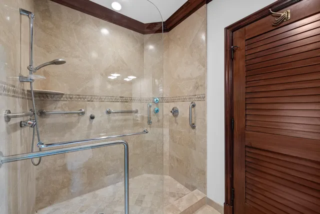 a spacious bathroom with a tub double sink window and mirror