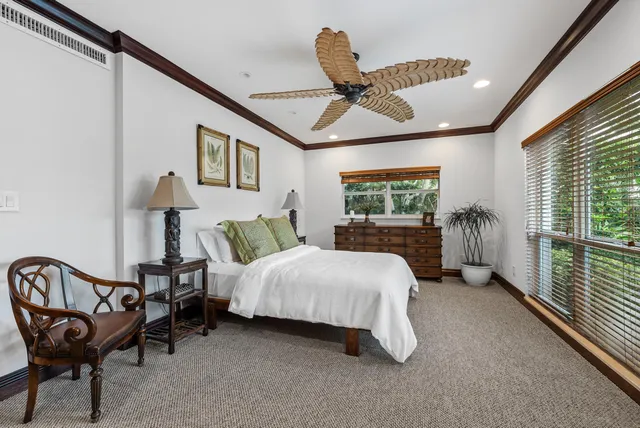 a bathroom with a granite countertop sink toilet a large mirror a bathtub and shower