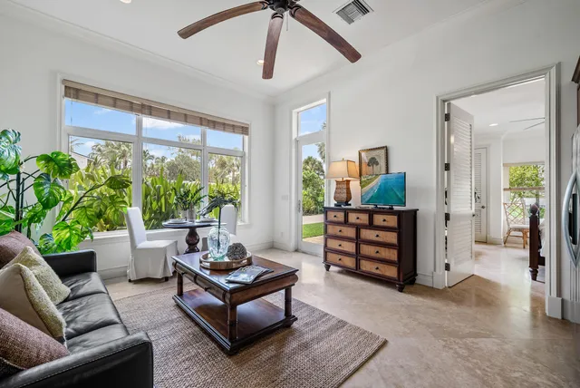 a bathroom with a granite countertop sink a toilet and mirror