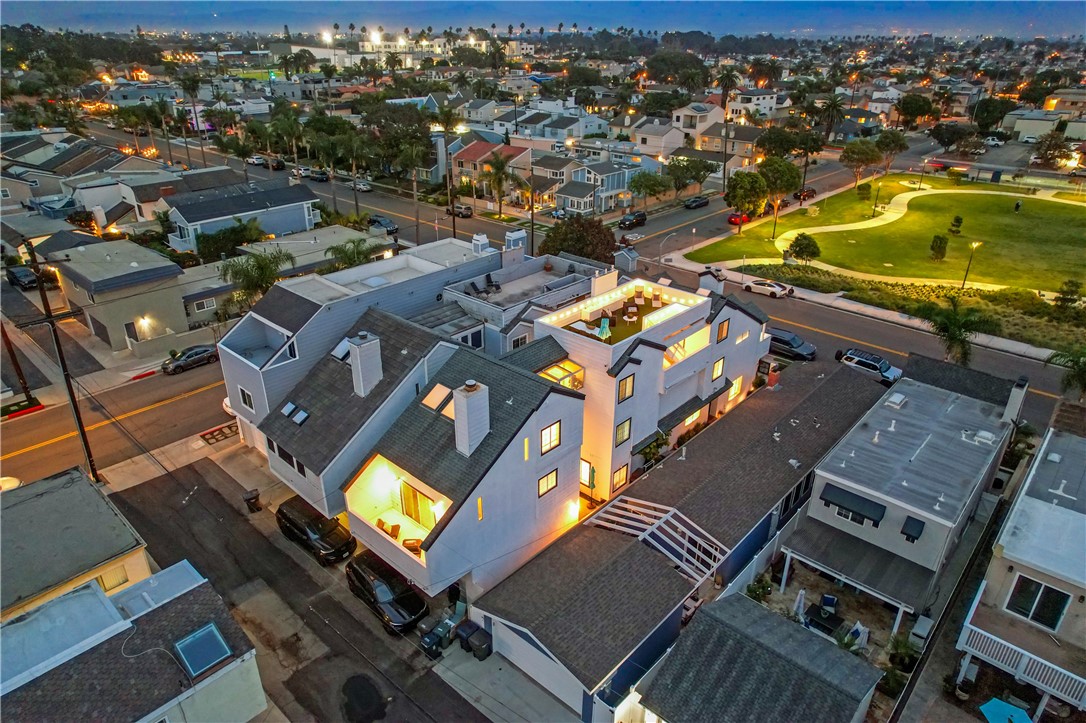 an aerial view of a residential apartment building with swimming pool