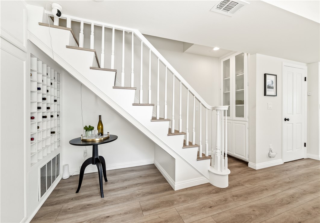 423 18th Street Huntington Beach, CA 92648 - Photo 18 of 67 a view of entryway with wooden floor and stairs