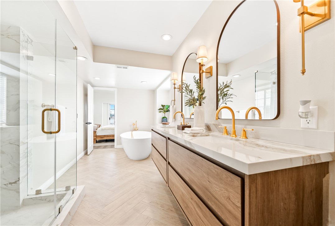 423 18th Street Huntington Beach, CA 92648 - Photo 25 of 67 a spacious bathroom with a double vanity sink and a mirror