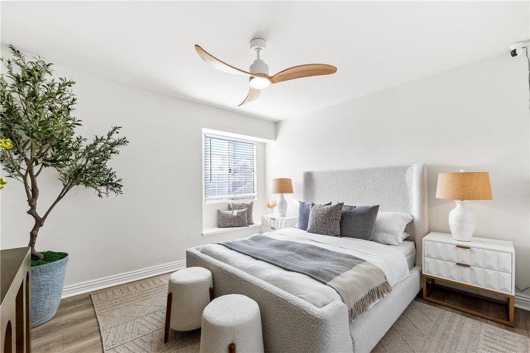 423 18th Street Huntington Beach, CA 92648 - Photo 29 of 67 a bedroom with a bed and a potted plant