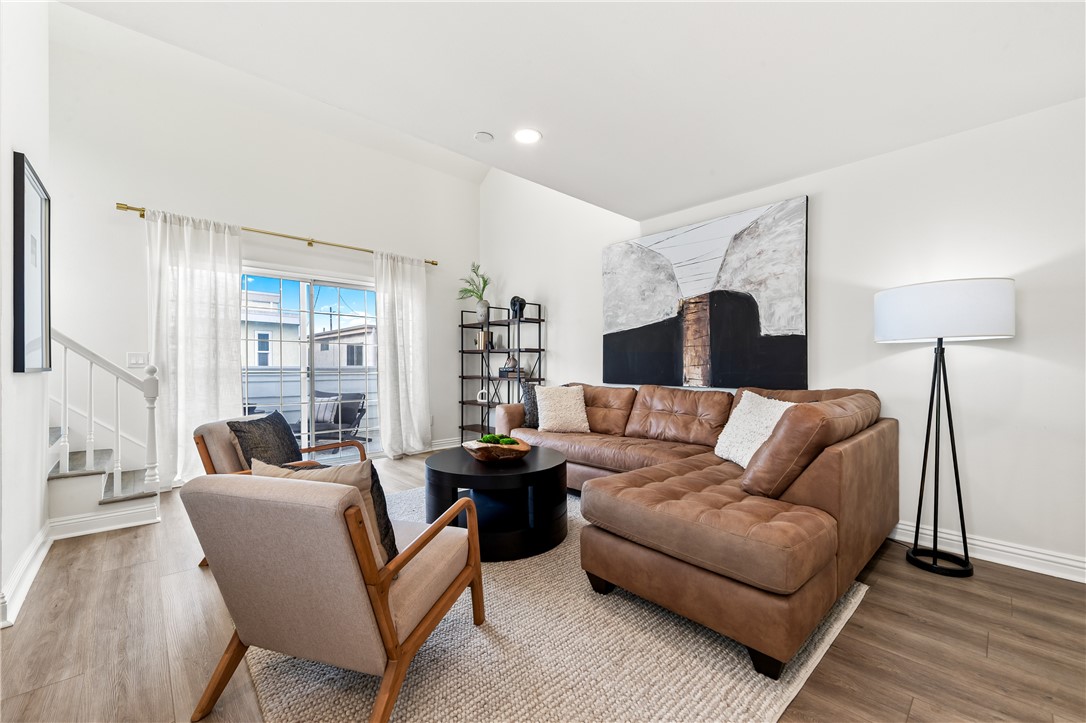 423 18th Street Huntington Beach, CA 92648 - Photo 38 of 67 a living room with furniture and a lamp