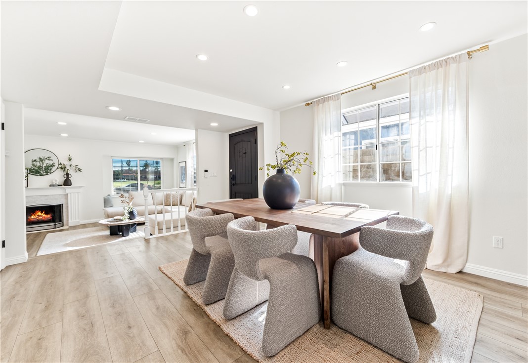 423 18th Street Huntington Beach, CA 92648 - Photo 4 of 67 a living room with furniture a wooden floor and a large window