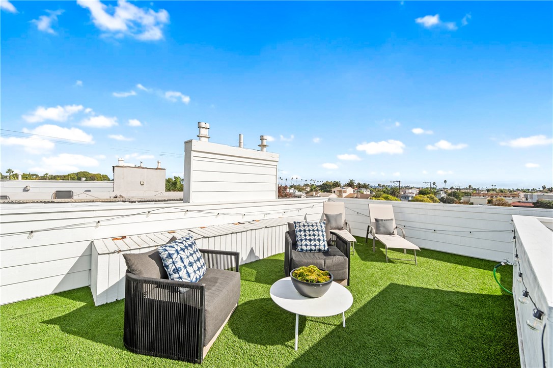 423 18th Street Huntington Beach, CA 92648 - Photo 53 of 67 a view of a ocean from a patio with swimming pool